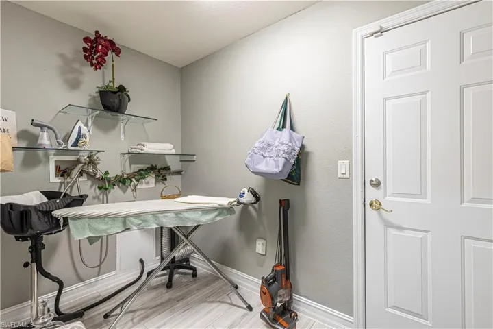 Laundry area featuring light hardwood / wood-style flooring (Washer and Dryer located in Garage w/ separate hookup)