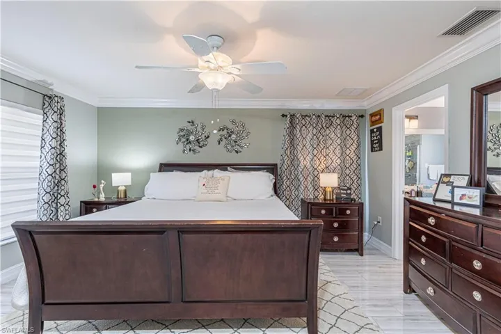 Bedroom featuring crown molding and ceiling fan