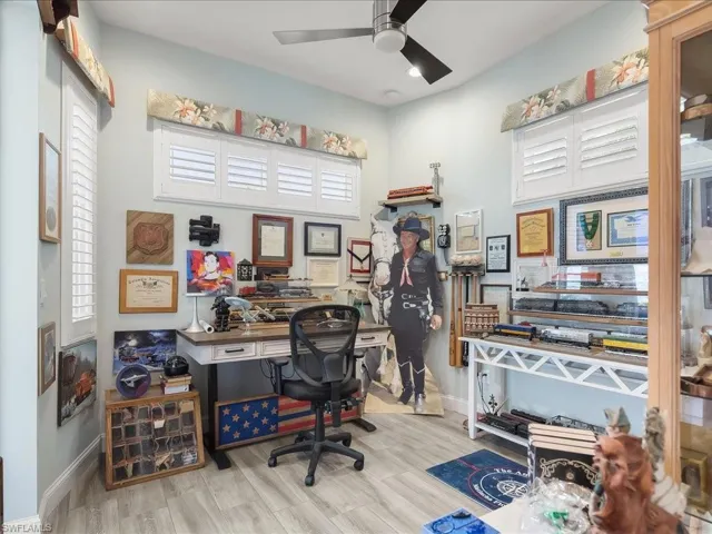 Office space with ceiling fan and wood finished floors