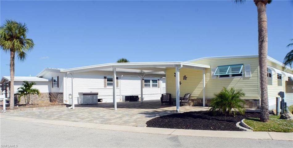 Exterior Front with reinforced carport and extra parking