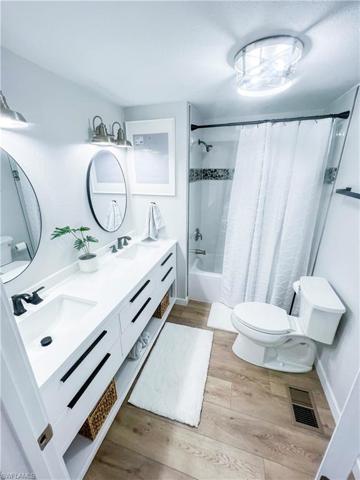 Hall to bedroom and bathrooms