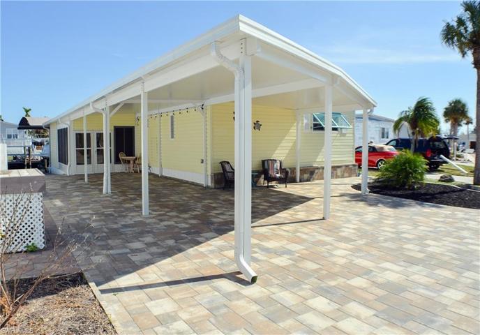 Exterior Front with reinforced carport and extra parking
