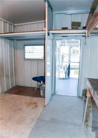 Storage and work area with access from the lanai and rear of home