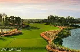 View of property's community with view of golf course and a water view