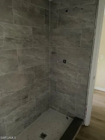 Bathroom featuring tiled shower