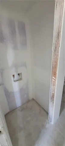 Bathroom featuring concrete flooring