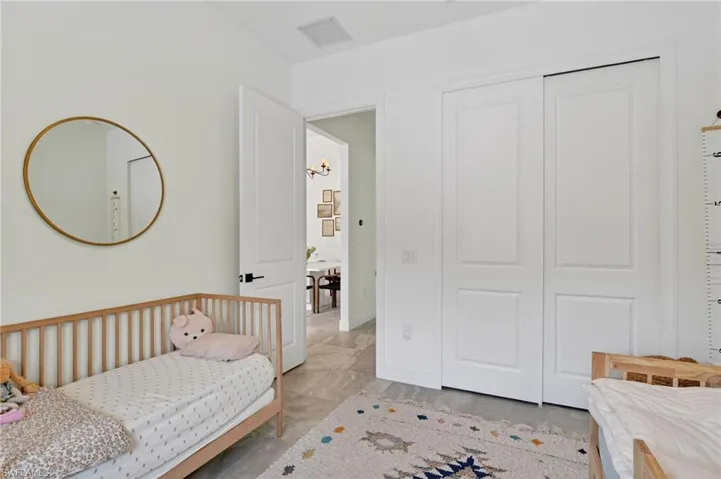 Bright room with light-colored walls and large format tile flooring