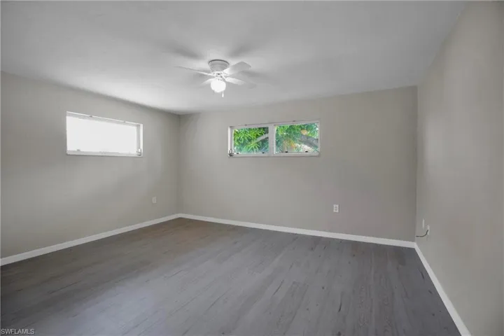 3rd Bedroom featuring ceiling fan and wood-type flooring