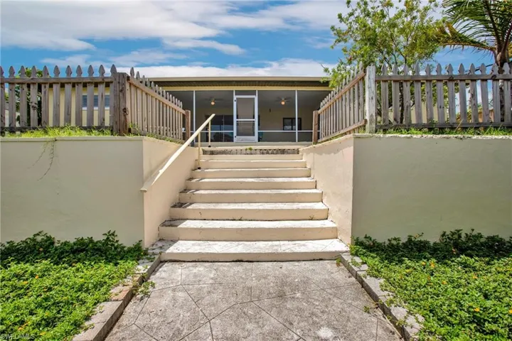 Property entrance featuring a patio area