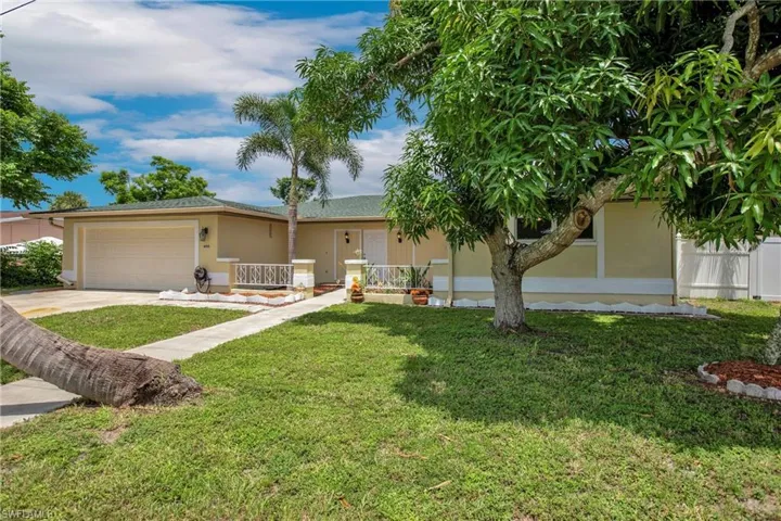 Front of home showing 1 if the Mango Trees
