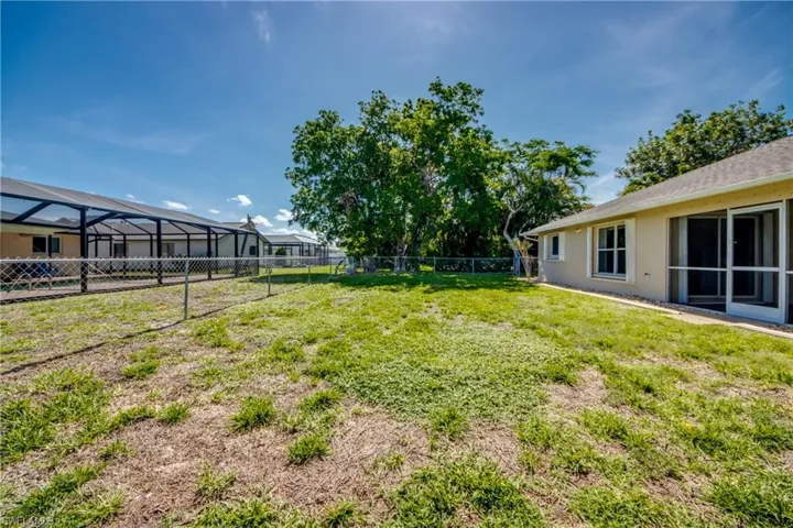 View of fenced backyard