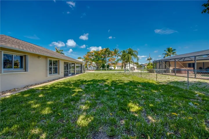 View of fenced backyard