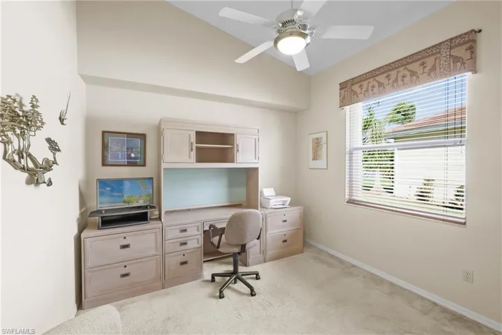 Carpeted 3rd Bedroom or home office with ceiling fan and lofted ceiling