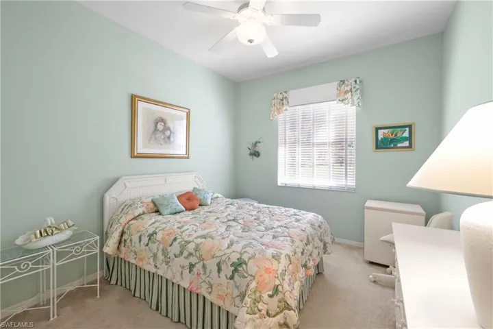 Bedroom with light carpet and ceiling fan