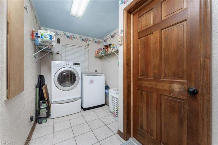 Indoor Laundry Room with built in ironing board