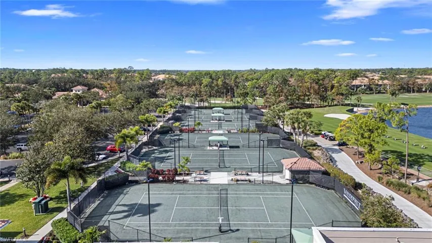 Drone / aerial view of a nearby body of water and a local golf course