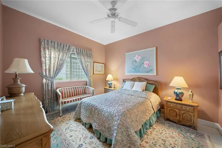Bedroom with baseboards and ceiling fan