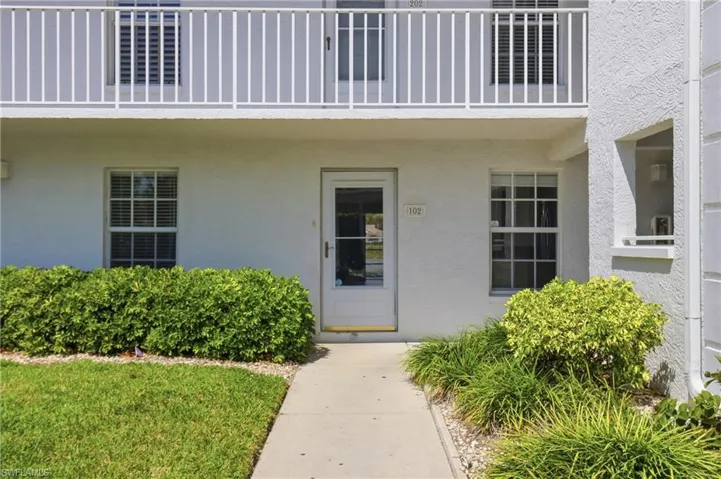 Doorway to property with stucco siding