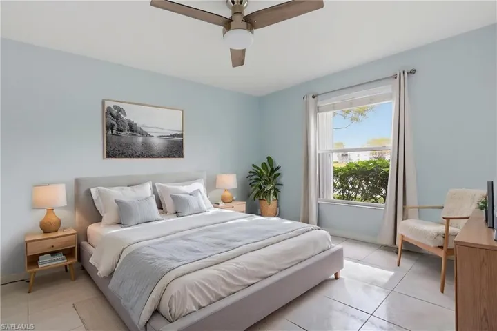 Bedroom featuring ceiling fan and light tile patterned flooring