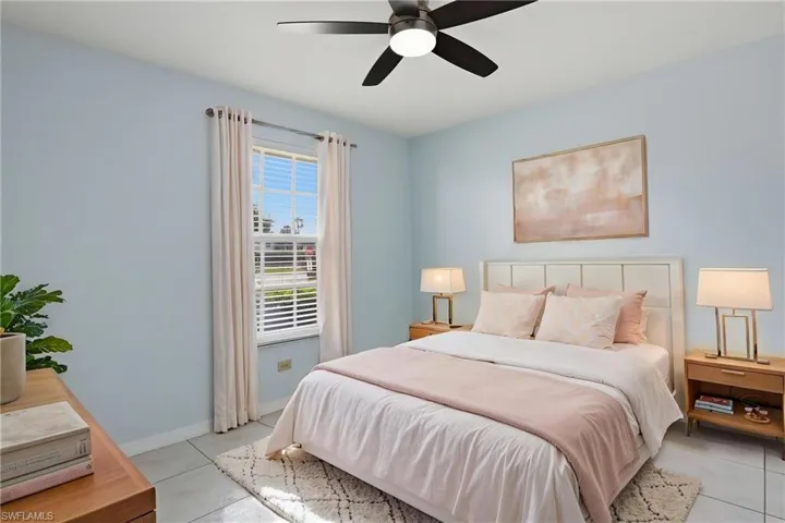 Bedroom featuring ceiling fan and light tile patterned flooring