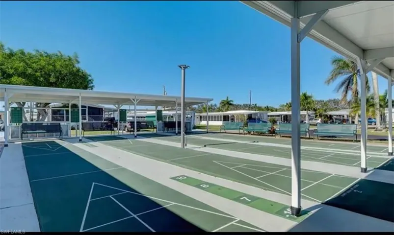 View of home's community with shuffleboard