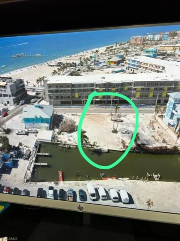 Drone / aerial view with a water view and a beach view