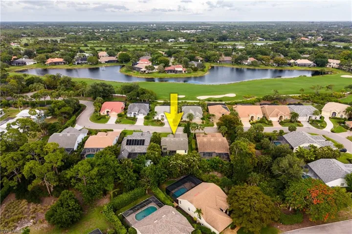Aerial perspective showcasing a residential property within a landscaped community