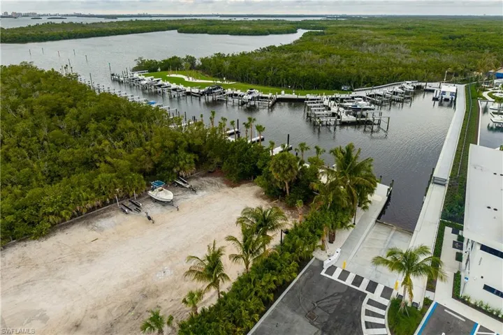 Deepwater marina featuring multiple boat slips, boat ramp, and direct access to open water