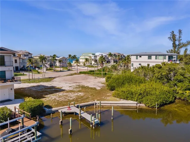 Dock featuring a residential view and a water view
