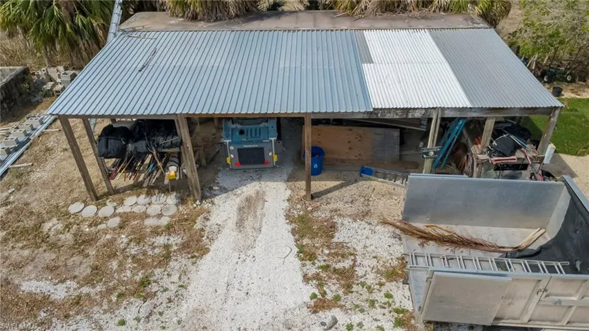 View of outdoor structure featuring a carport