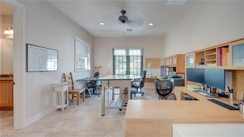 Office area with full bathroom that can also be used as MIL suite with a ceiling fan and recessed lighting