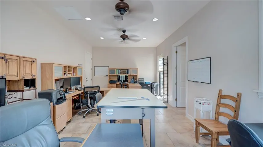 Office area  with full bathroom that can also be used as MIL suite with a ceiling fan and recessed lighting