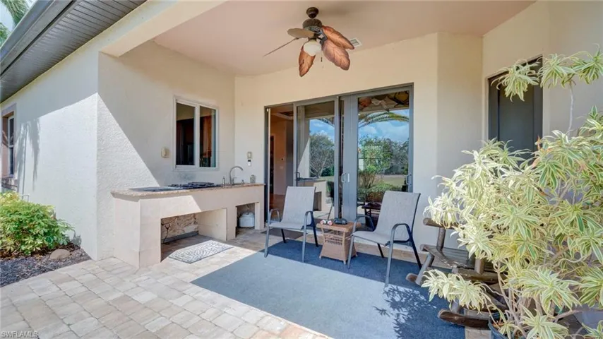 View of patio / terrace with a outdoor kitchen and a ceiling fan