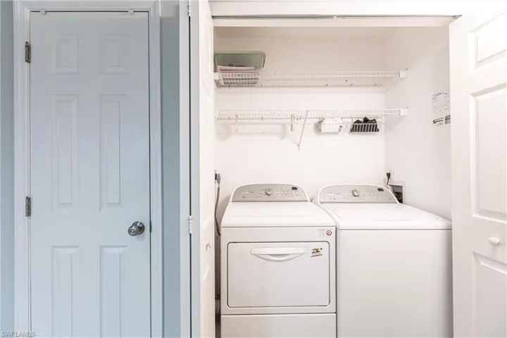 Laundry room with washing machine and dryer