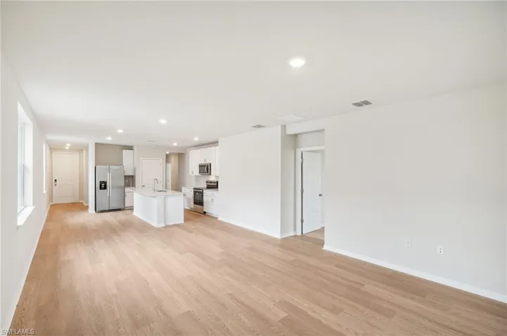 Unfurnished living room with light hardwood / wood-style flooring