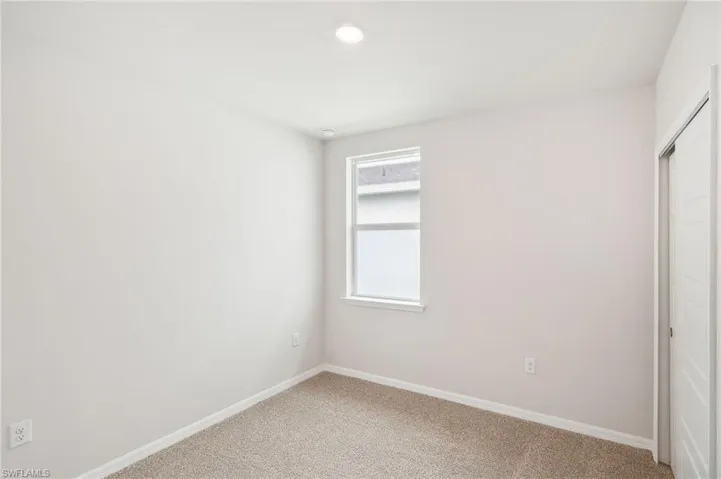 Spare room with carpet floors