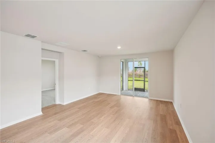Unfurnished room with light hardwood / wood-style floors