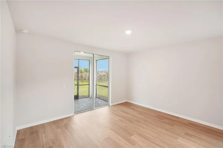 Unfurnished room with light hardwood / wood-style flooring