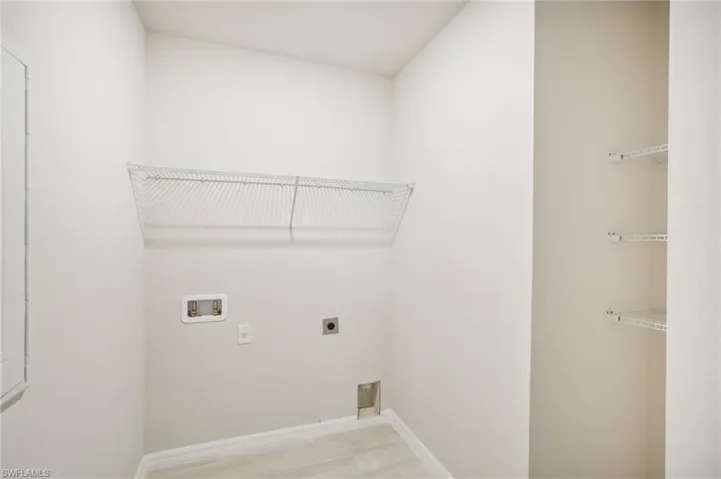 Laundry room featuring hookup for a washing machine and hookup for an electric dryer