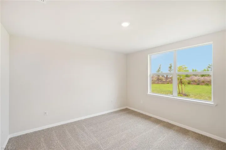 Spare room featuring carpet floors