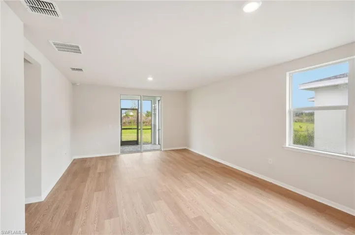Unfurnished room with light hardwood / wood-style floors