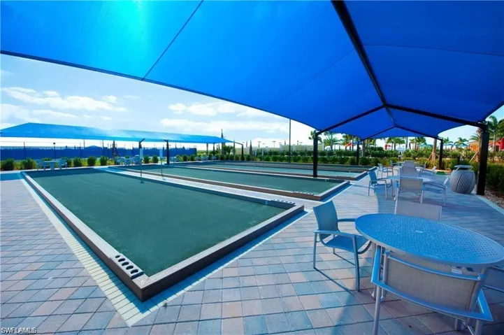 View of community featuring a bocce ball area and a patio area
