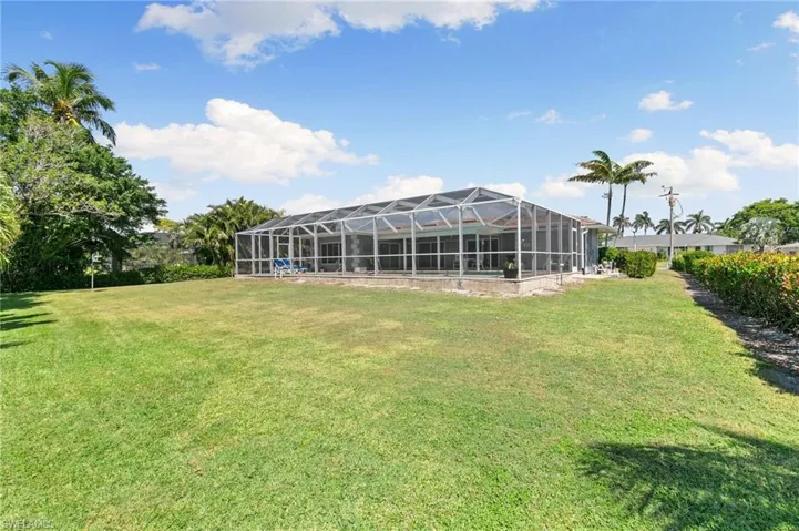 View of yard featuring a lanai