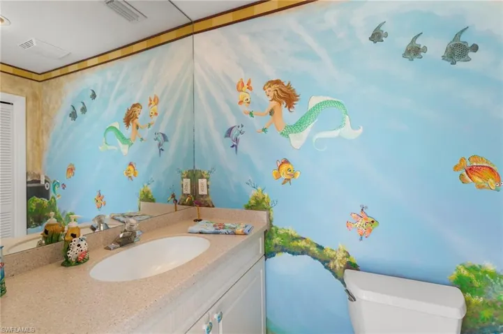 Bathroom with visible vents, toilet, and vanity