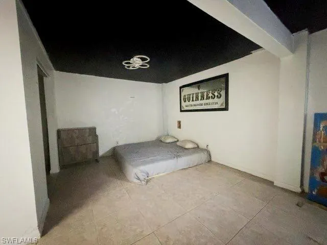 Tiled flooring extending throughout the room