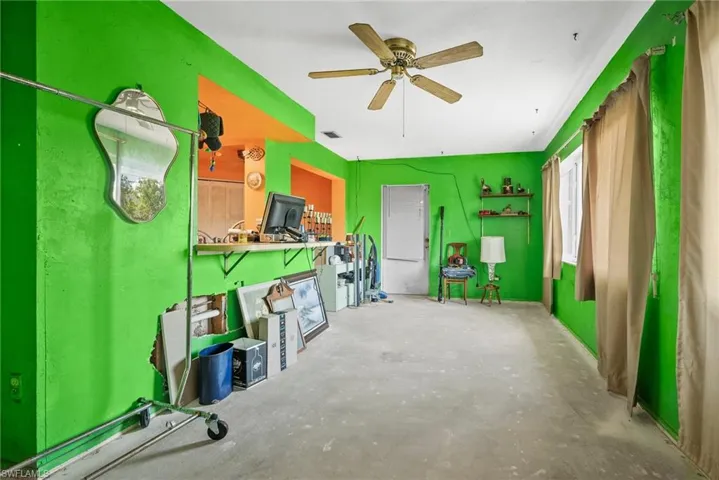 Storage with visible vents and a ceiling fan