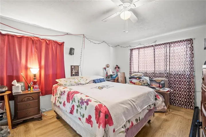 Bedroom featuring wood finished floors and ceiling fan