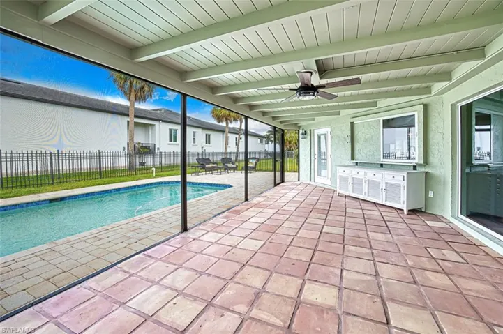 View of pool with a fenced in pool, an outdoor kitchen, a patio area, ceiling fan, and a fenced backyard