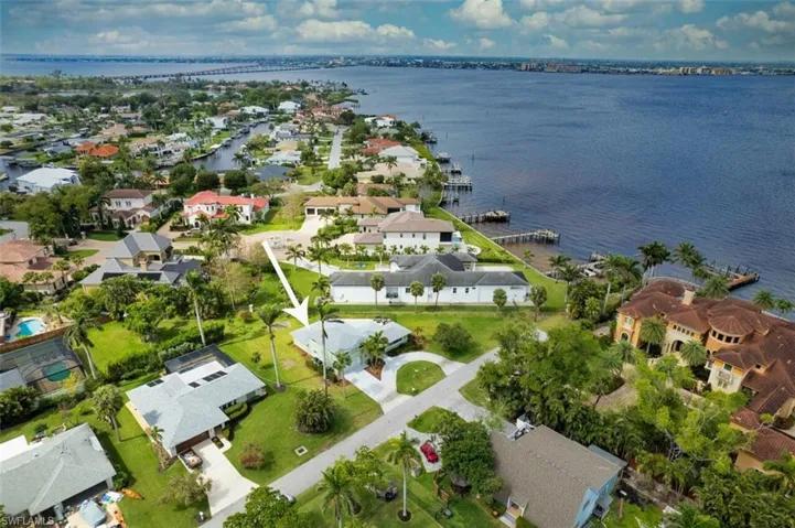 Aerial view featuring a water view and a residential view