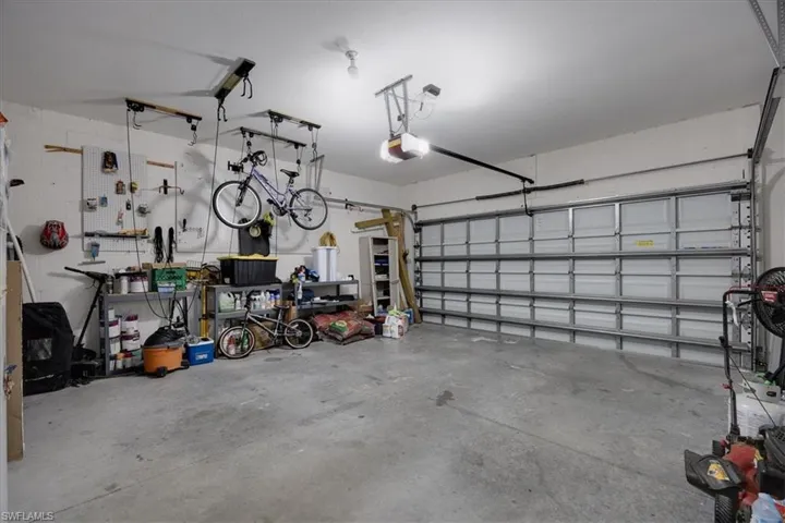 Garage featuring a garage door opener